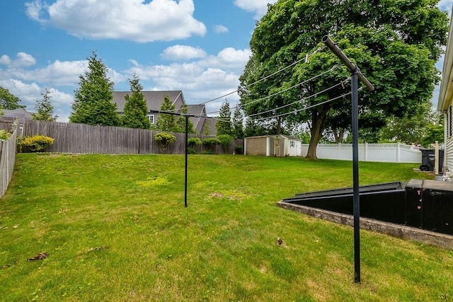 23 Willard St, Dedham, MA 02026 - fenced backyard featuring a storage shed