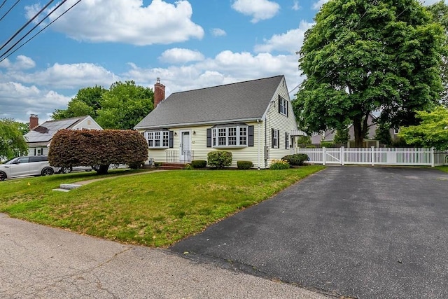 23 Willard St, Dedham, MA 02026 - cape cod home with a chimney and a gate