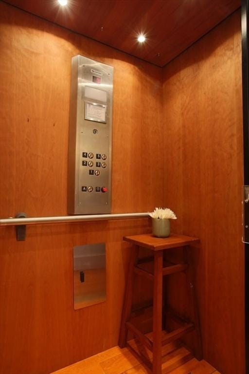 interior details featuring wood ceiling and elevator