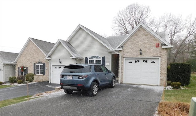 ranch-style home featuring a garage