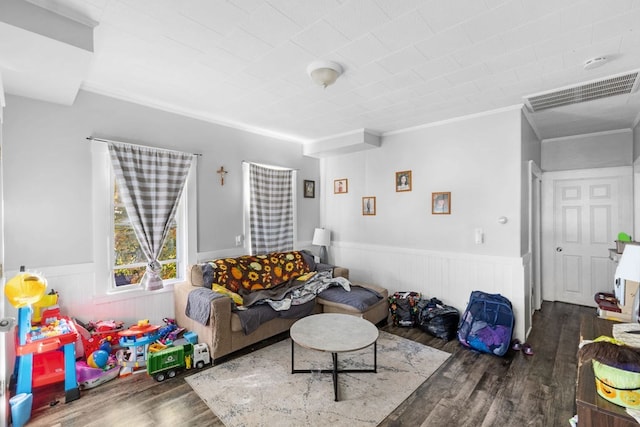 living room with dark hardwood / wood-style floors and ornamental molding