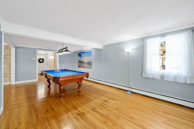 game room with a baseboard radiator, ornamental molding, pool table, and light wood-type flooring