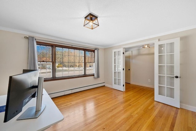 interior space featuring french doors, ornamental molding, baseboard heating, and light wood-type flooring