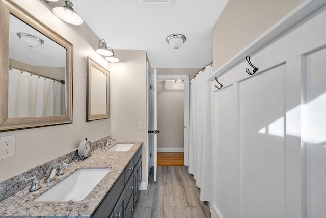 bathroom featuring vanity and hardwood / wood-style floors