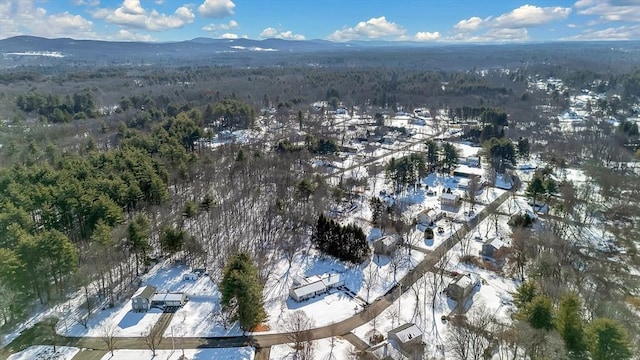 snowy aerial view with a mountain view