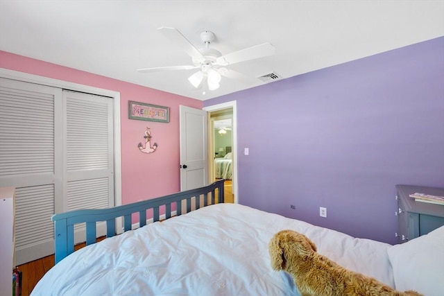 bedroom featuring ceiling fan and a closet