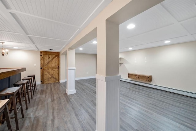 interior space featuring wood-type flooring and a barn door