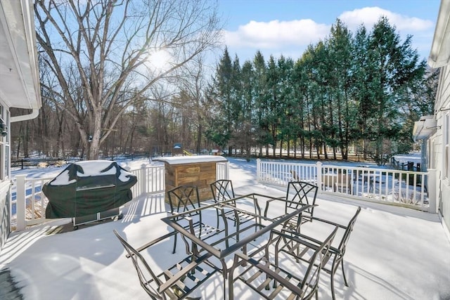 snow covered patio featuring a bar and grilling area