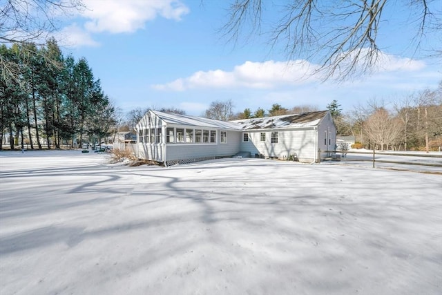 view of snow covered property