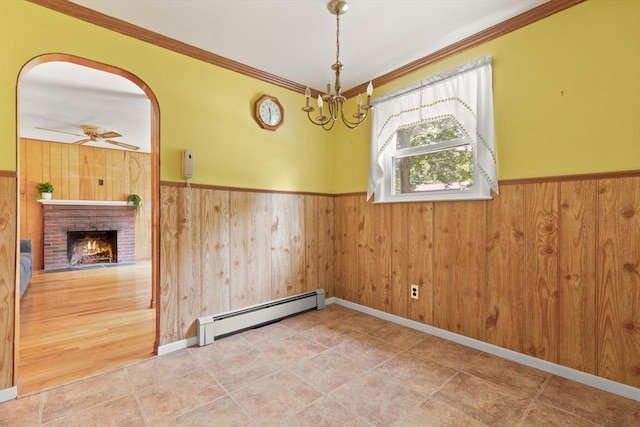 133 Allen Rd, Easton, MA 02356 - unfurnished dining area featuring a baseboard heating unit, a wainscoted wall, wood walls, ornamental molding, and ceiling fan