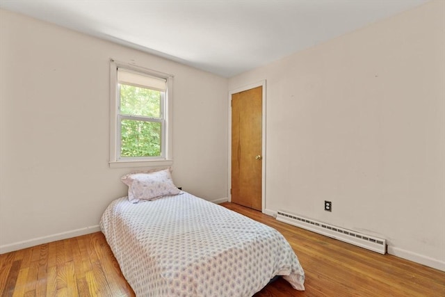 133 Allen Rd, Easton, MA 02356 - bedroom featuring baseboard heating and wood finished floors