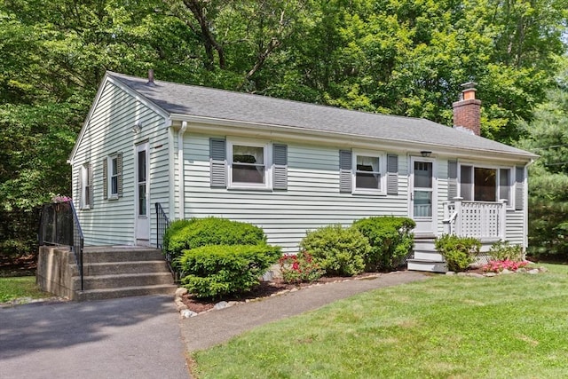 133 Allen Rd, Easton, MA 02356 - view of front of home with a chimney, a front lawn, and roof with shingles