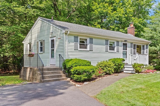 133 Allen Rd, Easton, MA 02356 - view of front facade with a chimney and a front yard