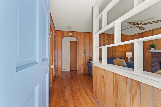 133 Allen Rd, Easton, MA 02356 - hall with wood walls, arched walkways, wood finished floors, and a baseboard radiator