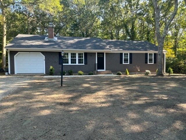 single story home featuring a garage