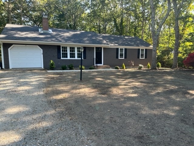 single story home featuring a garage