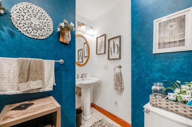 71 Draper St, Boston, MA 02122 - bathroom featuring toilet, tile patterned floors, baseboards, and a sink
