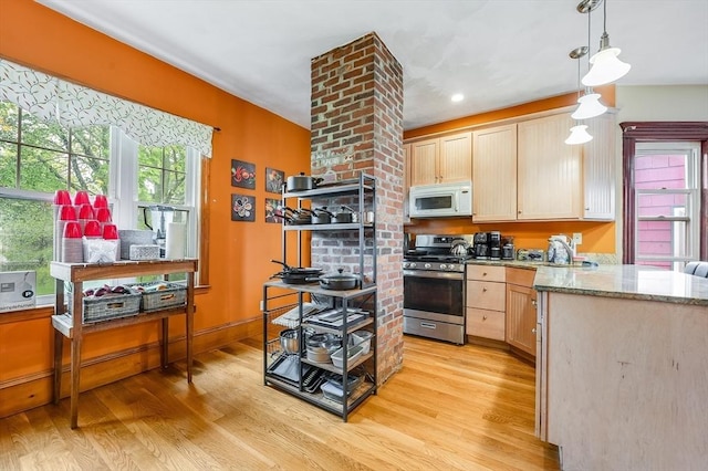 71 Draper St, Boston, MA 02122 - kitchen featuring gas range, white microwave, light wood-style flooring, light brown cabinetry, and recessed lighting