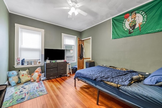 71 Draper St, Boston, MA 02122 - bedroom with wood-type flooring, crown molding, ceiling fan, and cooling unit