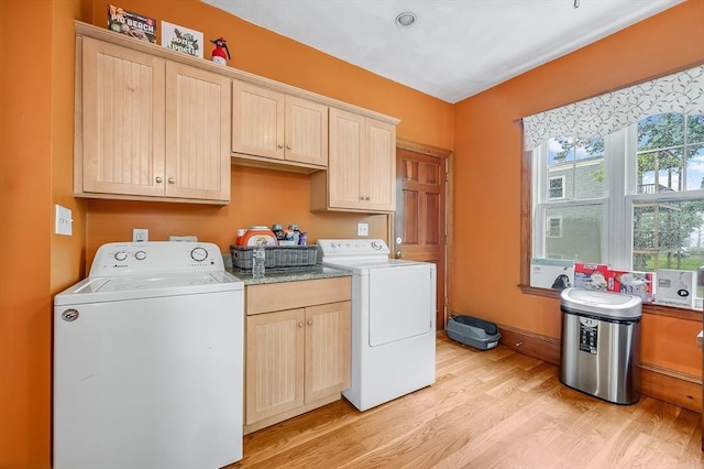 71 Draper St, Boston, MA 02122 - washroom featuring light wood finished floors, cabinet space, and washer and dryer
