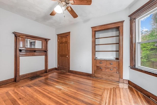 71 Draper St, Boston, MA 02122 - empty room with hardwood / wood-style flooring, baseboards, and ceiling fan