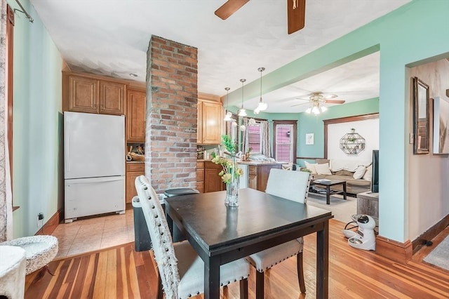 71 Draper St, Boston, MA 02122 - dining room featuring ceiling fan, baseboards, and light wood finished floors