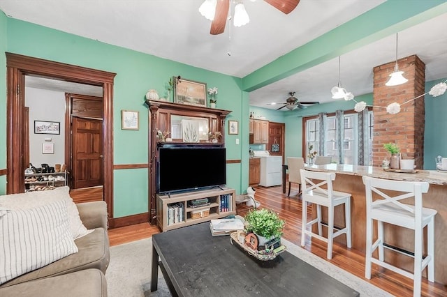71 Draper St, Boston, MA 02122 - living room featuring ceiling fan, light wood-style flooring, and washer / dryer