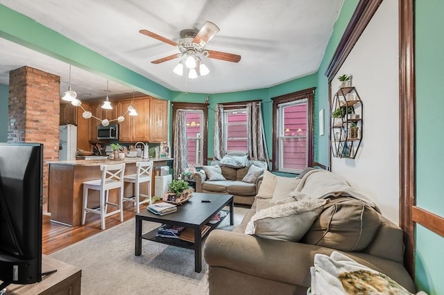 71 Draper St, Boston, MA 02122 - living area featuring a ceiling fan and light wood-style floors
