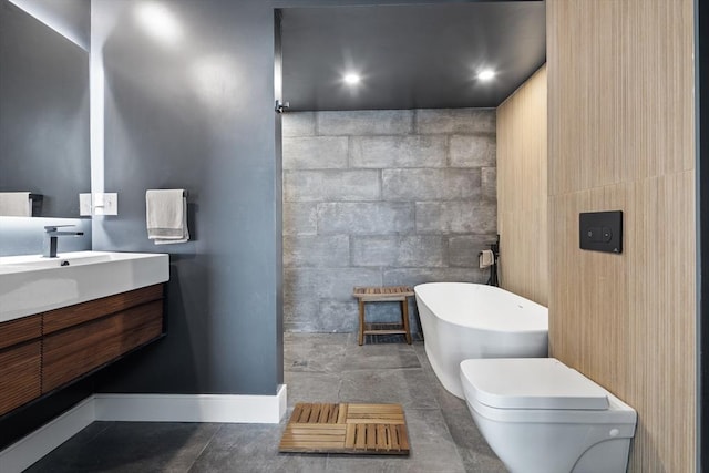 437 D St Unit 3D, Boston, MA 02210 - bathroom with a freestanding tub, vanity, toilet, and baseboards