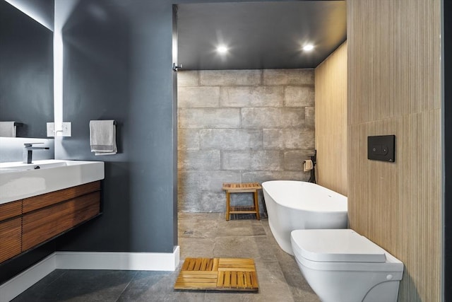 437 D St Unit 3D, Boston, MA 02210 - full bathroom with a freestanding bath, vanity, toilet, and baseboards