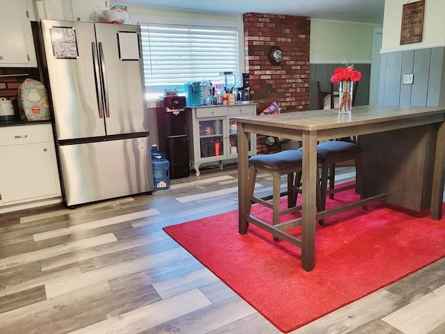 dining area featuring light wood-style flooring