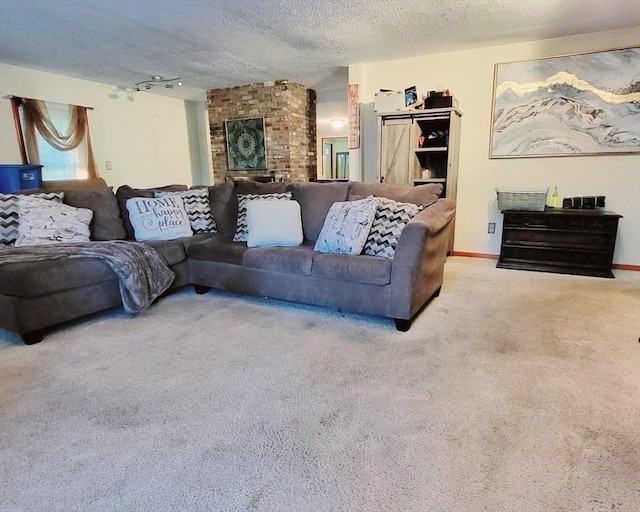 living area with carpet and a textured ceiling