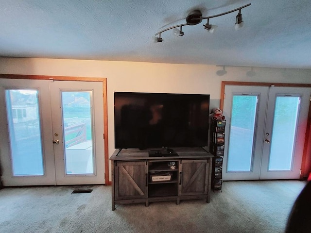 living room with french doors and carpet floors
