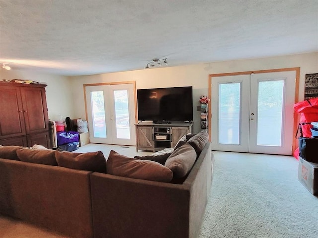 living room with french doors and light carpet