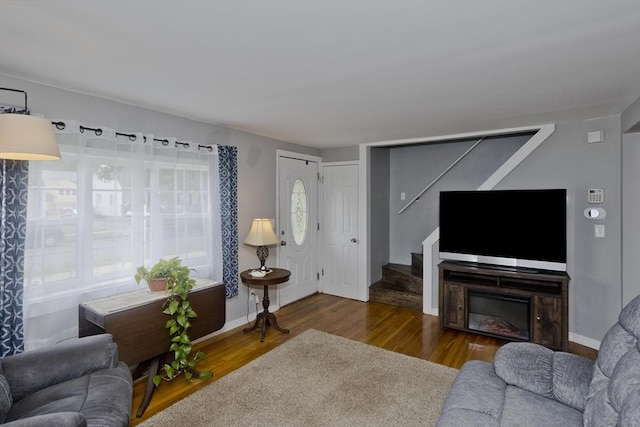 156 Powell, Springfield, MA 01118 - living area featuring stairway, plenty of natural light, wood finished floors, and baseboards