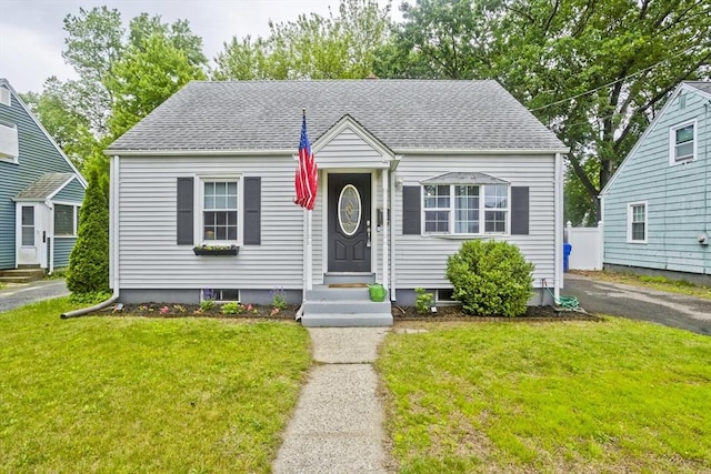 156 Powell, Springfield, MA 01118 - view of front facade with a front yard, a shingled roof, and entry steps