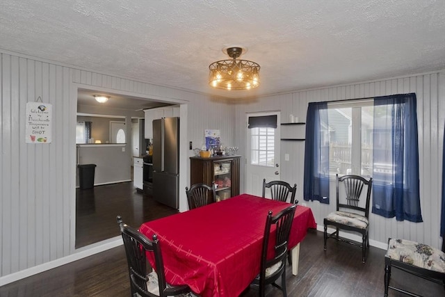 156 Powell, Springfield, MA 01118 - dining area featuring a textured ceiling, dark wood-style floors, baseboards, and a chandelier