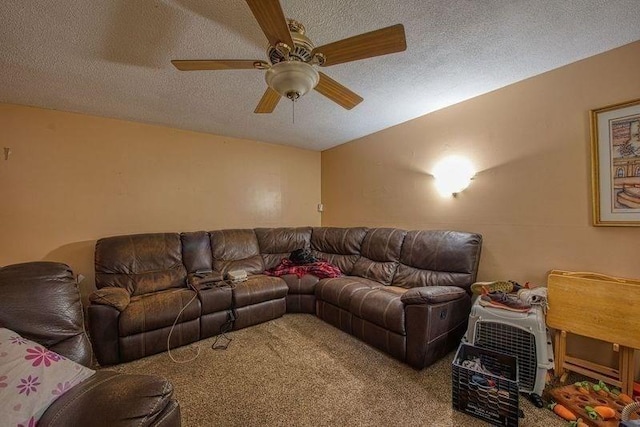 carpeted living area featuring ceiling fan and a textured ceiling