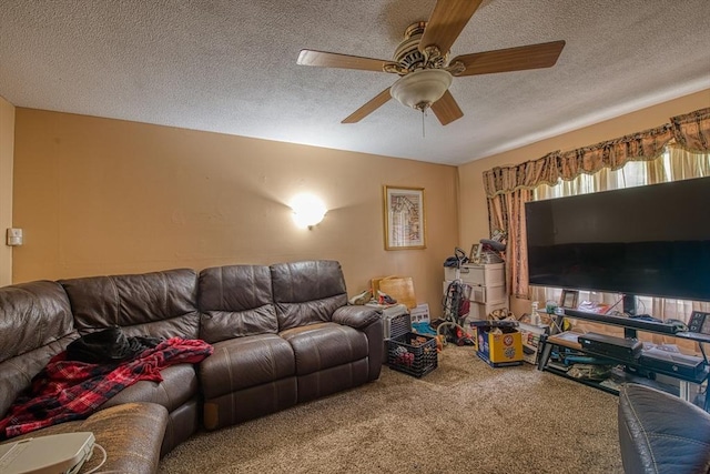 living area with carpet floors, a textured ceiling, and a ceiling fan