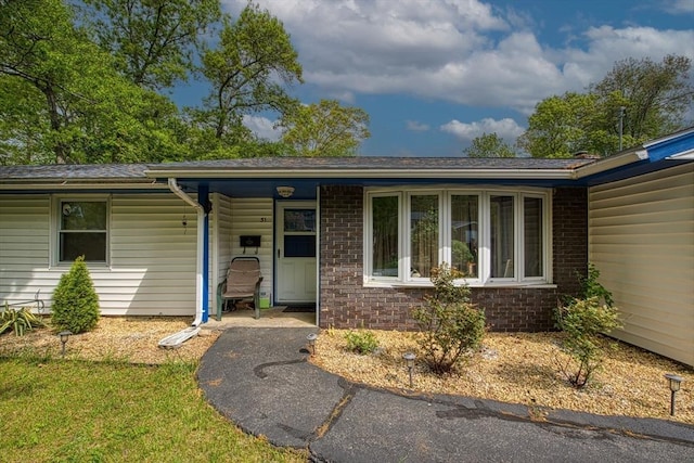 view of front of house featuring brick siding