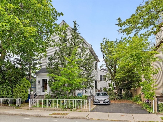 19 Tufts St, Somerville, MA 02145 - obstructed view of property featuring a fenced front yard