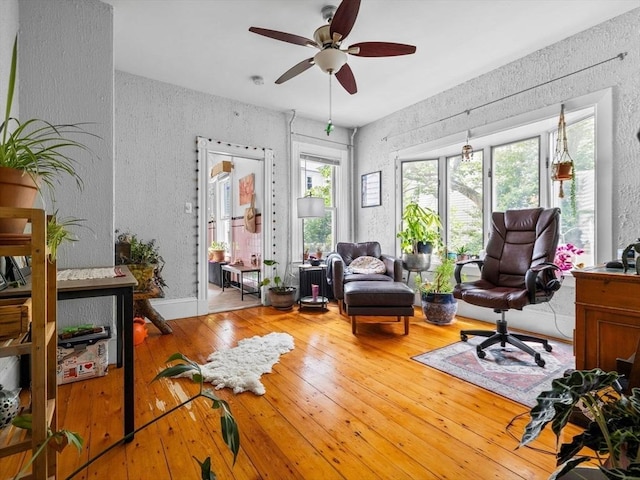 19 Tufts St, Somerville, MA 02145 - office with a textured wall, ceiling fan, and hardwood / wood-style flooring