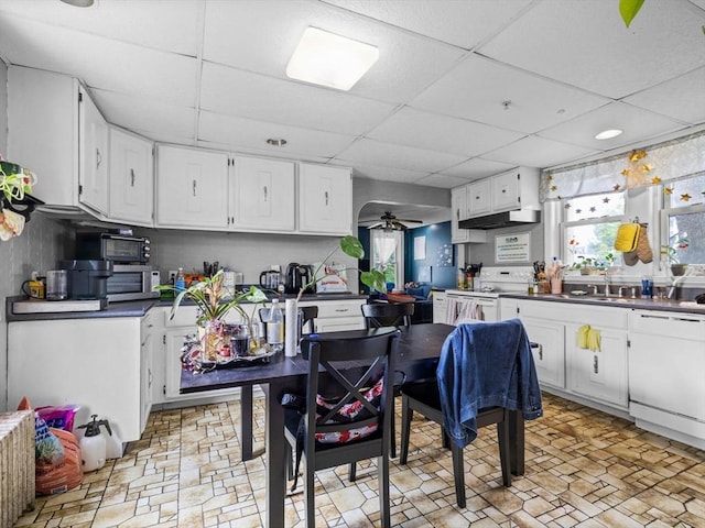 19 Tufts St, Somerville, MA 02145 - kitchen featuring white appliances, a drop ceiling, a ceiling fan, white cabinets, and dark countertops