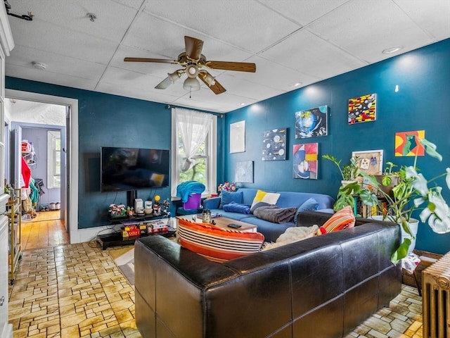 19 Tufts St, Somerville, MA 02145 - living room with ceiling fan, plenty of natural light, and brick patterned flooring