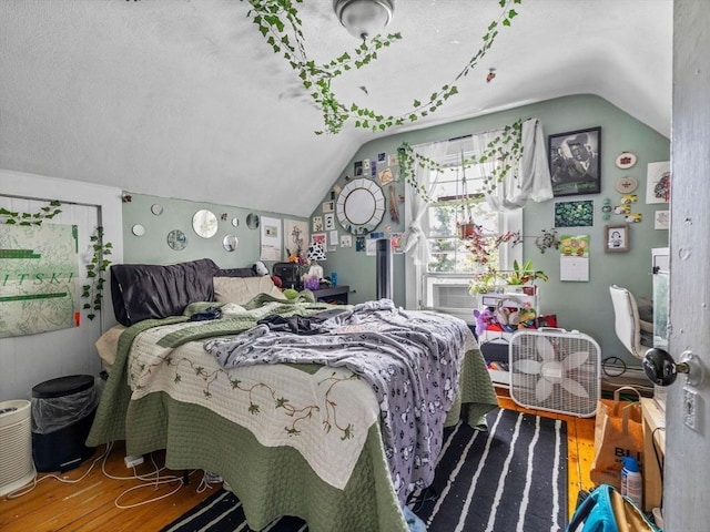 19 Tufts St, Somerville, MA 02145 - bedroom with vaulted ceiling and wood finished floors