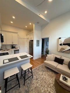 living room featuring recessed lighting and wood finished floors