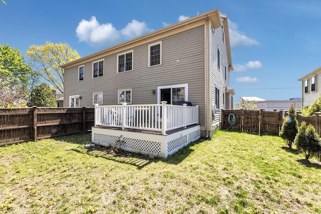back of property featuring a wooden deck