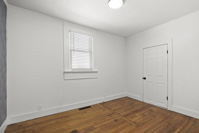 63 Adams St, Bourne, MA 02532 - unfurnished room featuring wood-type flooring, baseboards, and visible vents