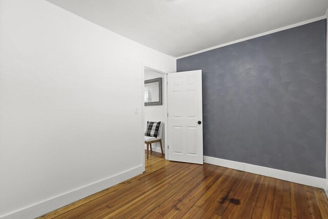 63 Adams St, Bourne, MA 02532 - empty room featuring baseboards and hardwood / wood-style floors