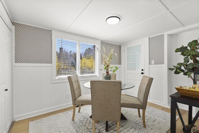63 Adams St, Bourne, MA 02532 - dining room with light wood-style floors and baseboards